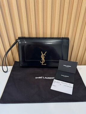 SAINT LAURENT cassandre flap pouch in shiny patent leather